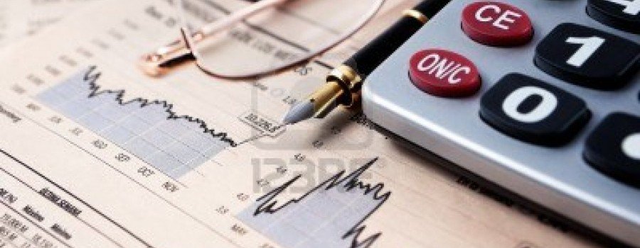 9866882-business-background-with-graphics-glasses-pen-and-calculator-900x350